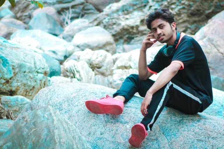 Abhishek Rawal, the youngest Indian musical and visual artist, surrounded by musical notes and vibrant colors.